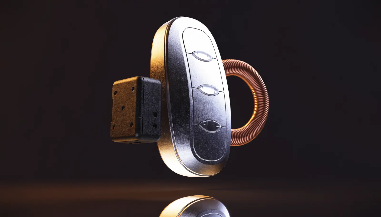 A car key fob beside an immobiliser control module and a coiled antenna ring