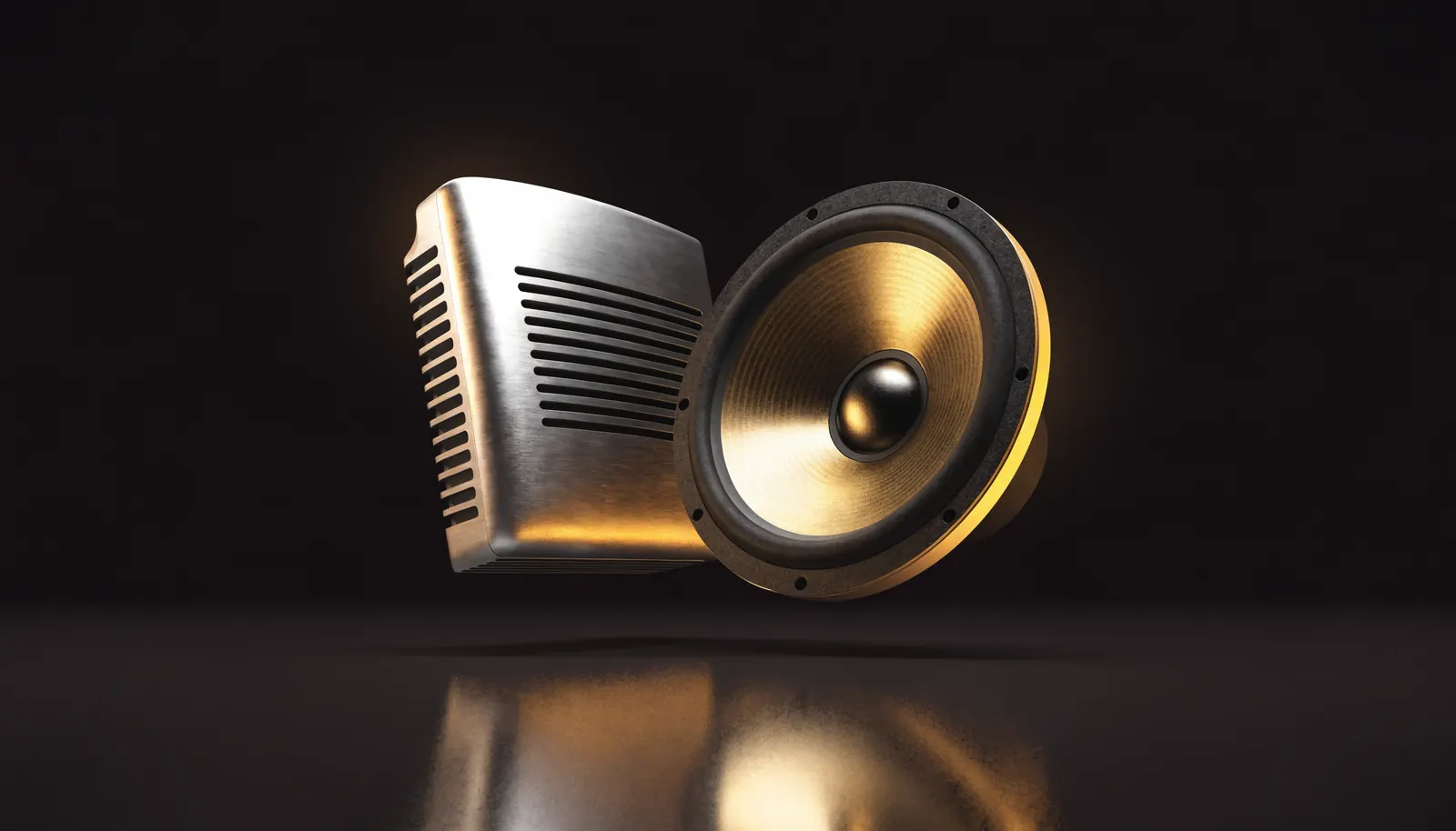 A car audio amplifier beside a subwoofer driver on a dark background