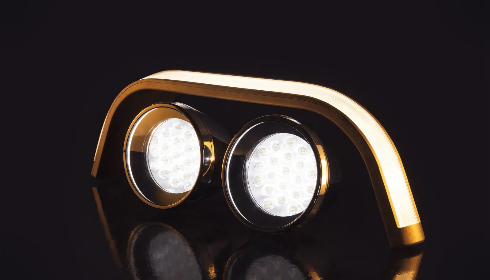 A curved LED light bar with a pair of round LED driving lights